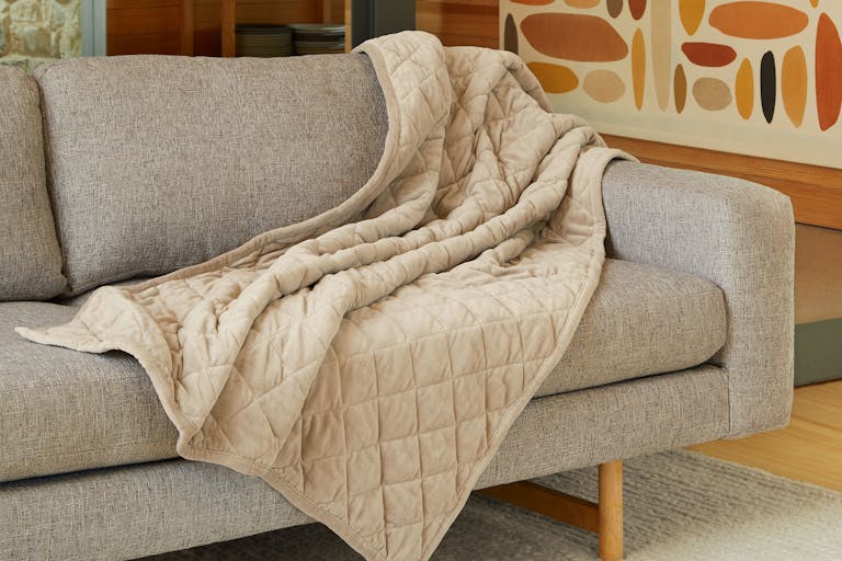 Weighted Blanket on sofa draped